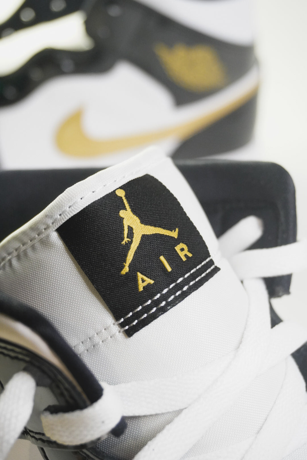 Jordan 1 Mid “Black Metallic Gold”
