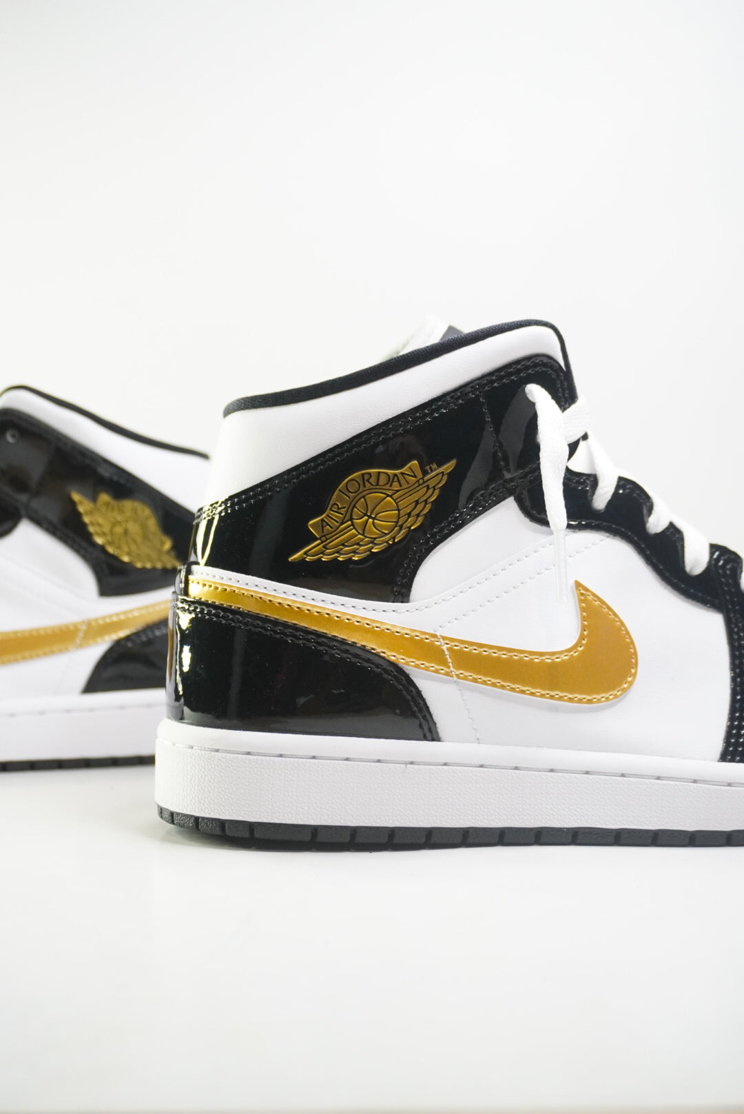 Jordan 1 Mid “Black Metallic Gold”